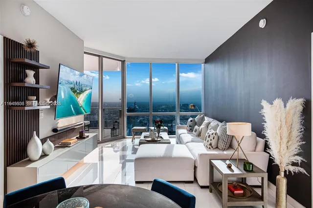 a living room with furniture and a flat screen tv