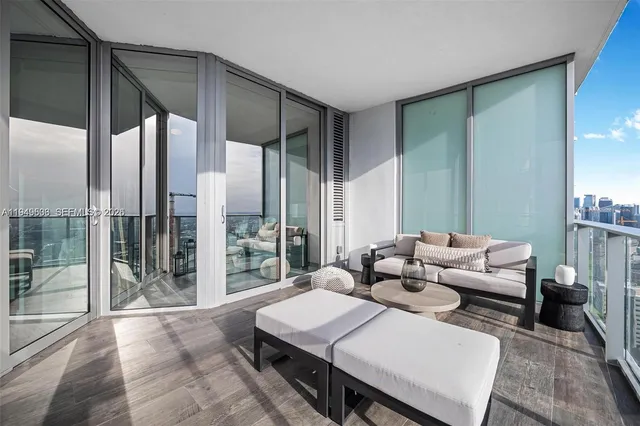 a large white kitchen with a large window