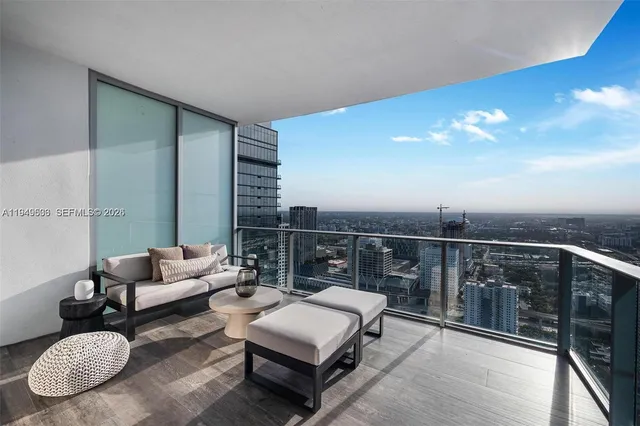 a bedroom with bed and a large mirror