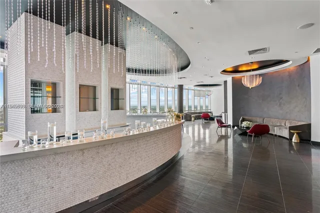 a bathroom with glass door shower and a glass door