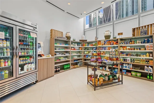 a view of a tall building with a palm tree in front of it