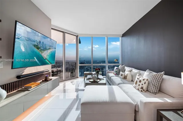 a living room with furniture and a flat screen tv