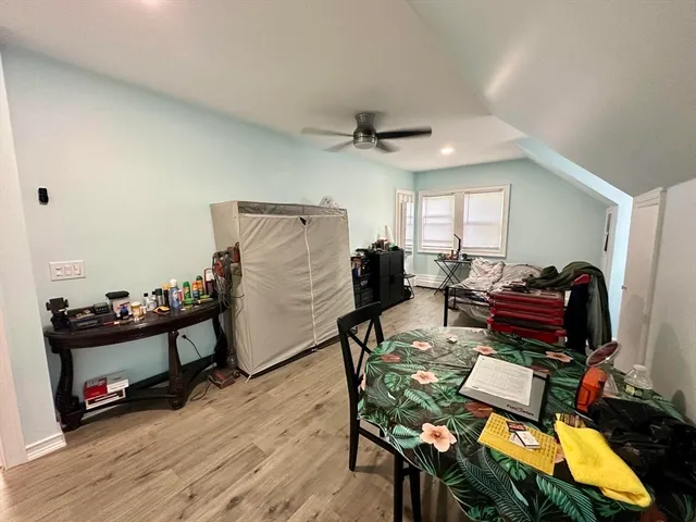 a view of a workspace with furniture and a flat screen tv