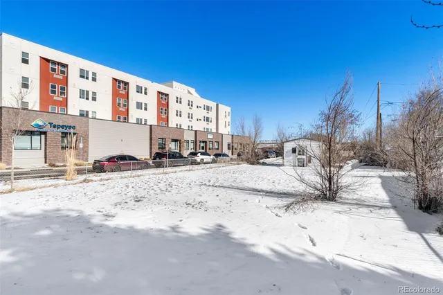 a view of a street with a building in the background