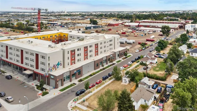 an aerial view of a building with an outdoor space