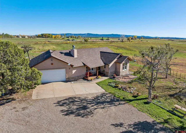an aerial view of a house with a outdoor space