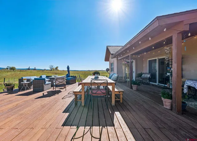 a view of a balcony with seating space