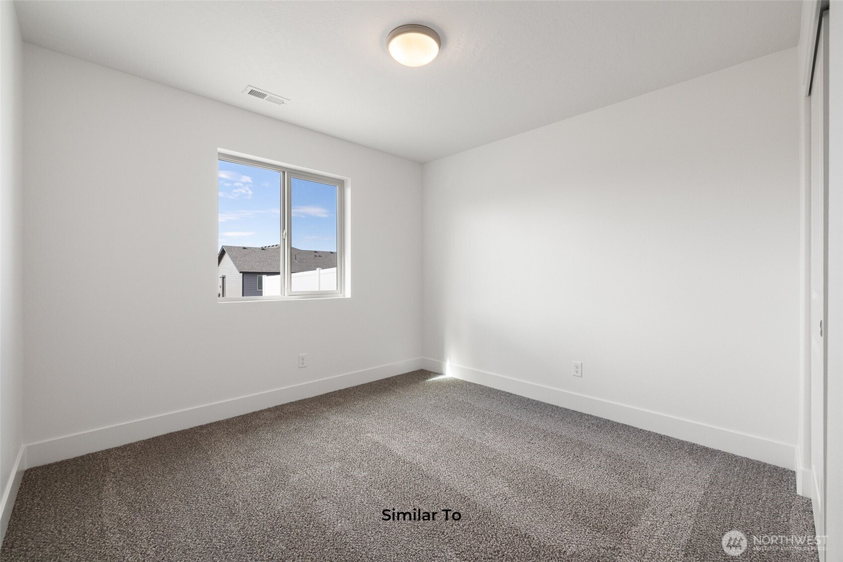 4251 Sandy Street Moses Lake, WA 98837 - Photo 17 of 19 an empty room with a window