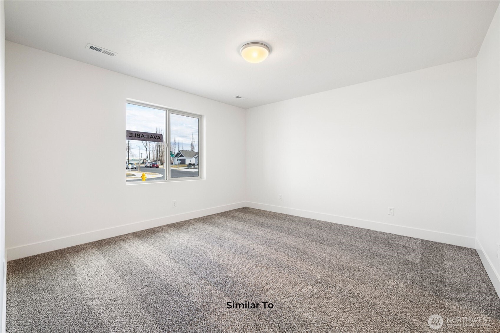4251 Sandy Street Moses Lake, WA 98837 - Photo 4 of 19 an empty room with windows