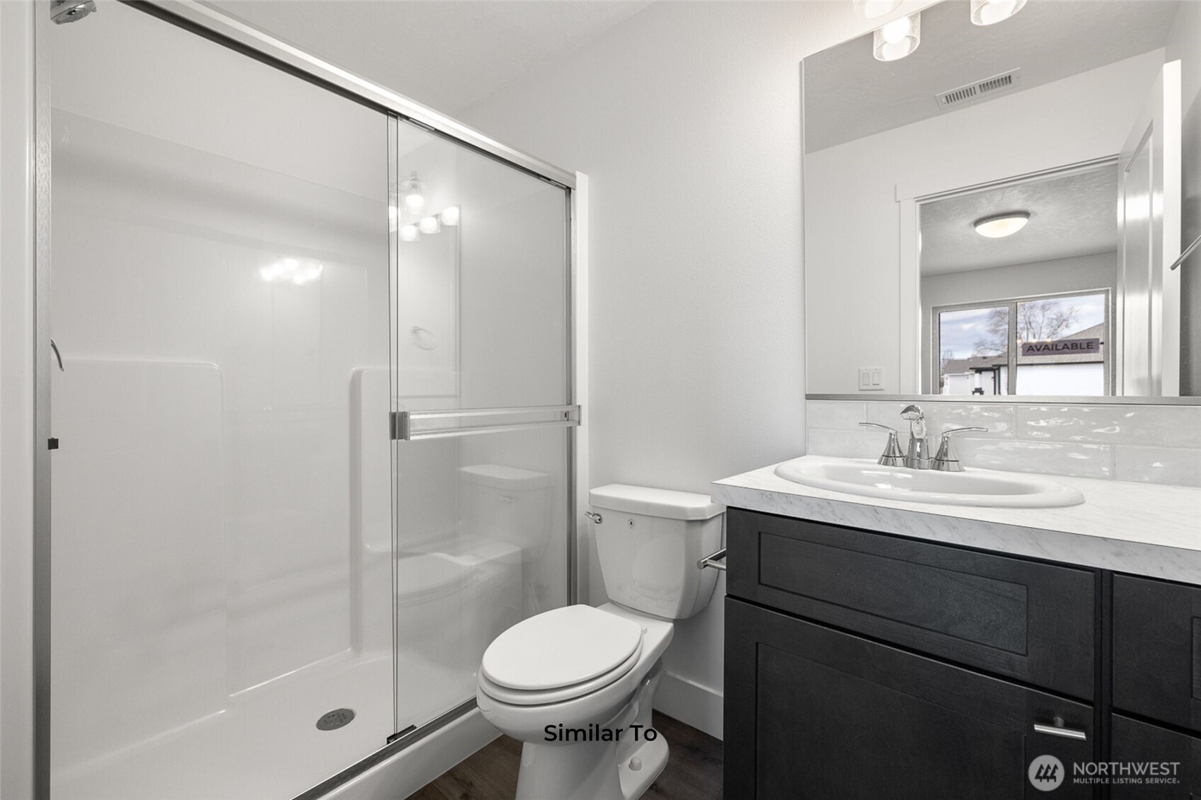 4251 Sandy Street Moses Lake, WA 98837 - Photo 6 of 19 a bathroom with a sink toilet and shower