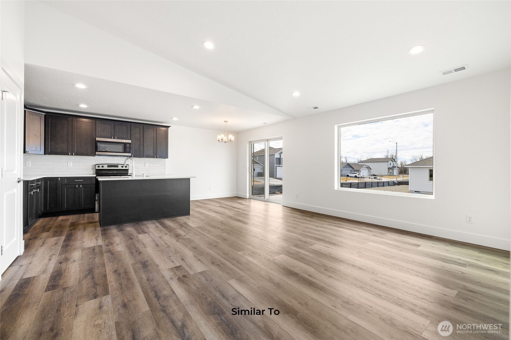 4251 Sandy Street Moses Lake, WA 98837 - Photo 8 of 19 a view of kitchen with wooden floor and electronic appliances