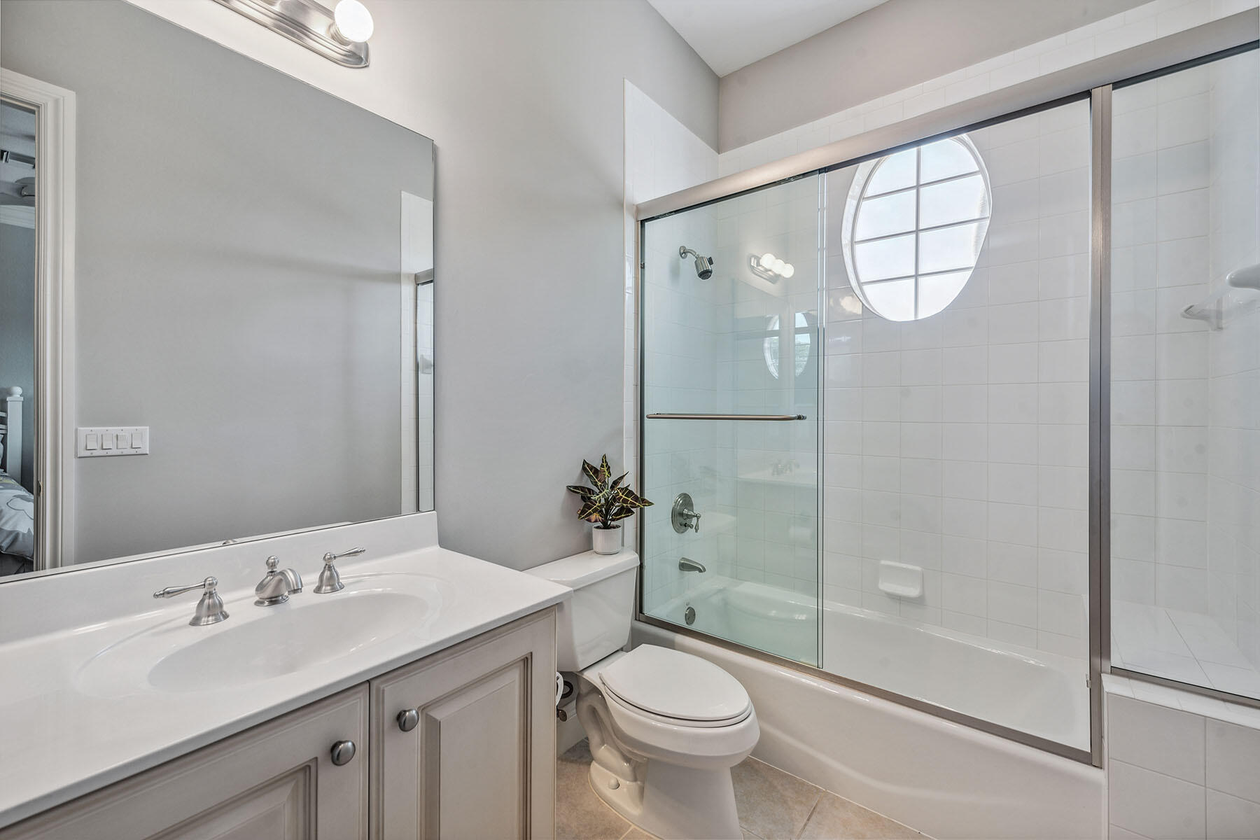 3189 Aviamar Circle, Unit 202 Naples, FL 34114 - Photo 17 of 50 a bathroom with a sink a toilet and shower