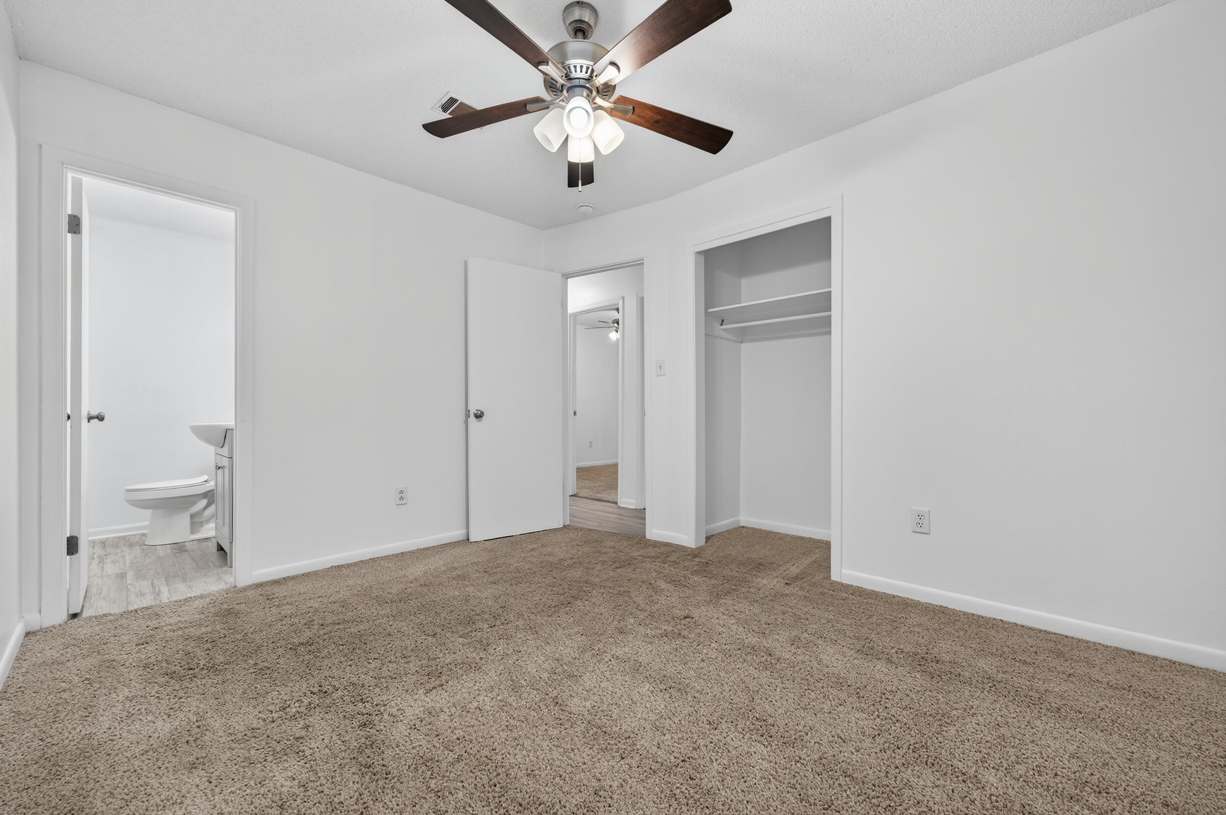 313 Brackin Street, Unit A Crestview, FL 32539 - Photo 18 of 28 a view of an empty room and a ceiling fan