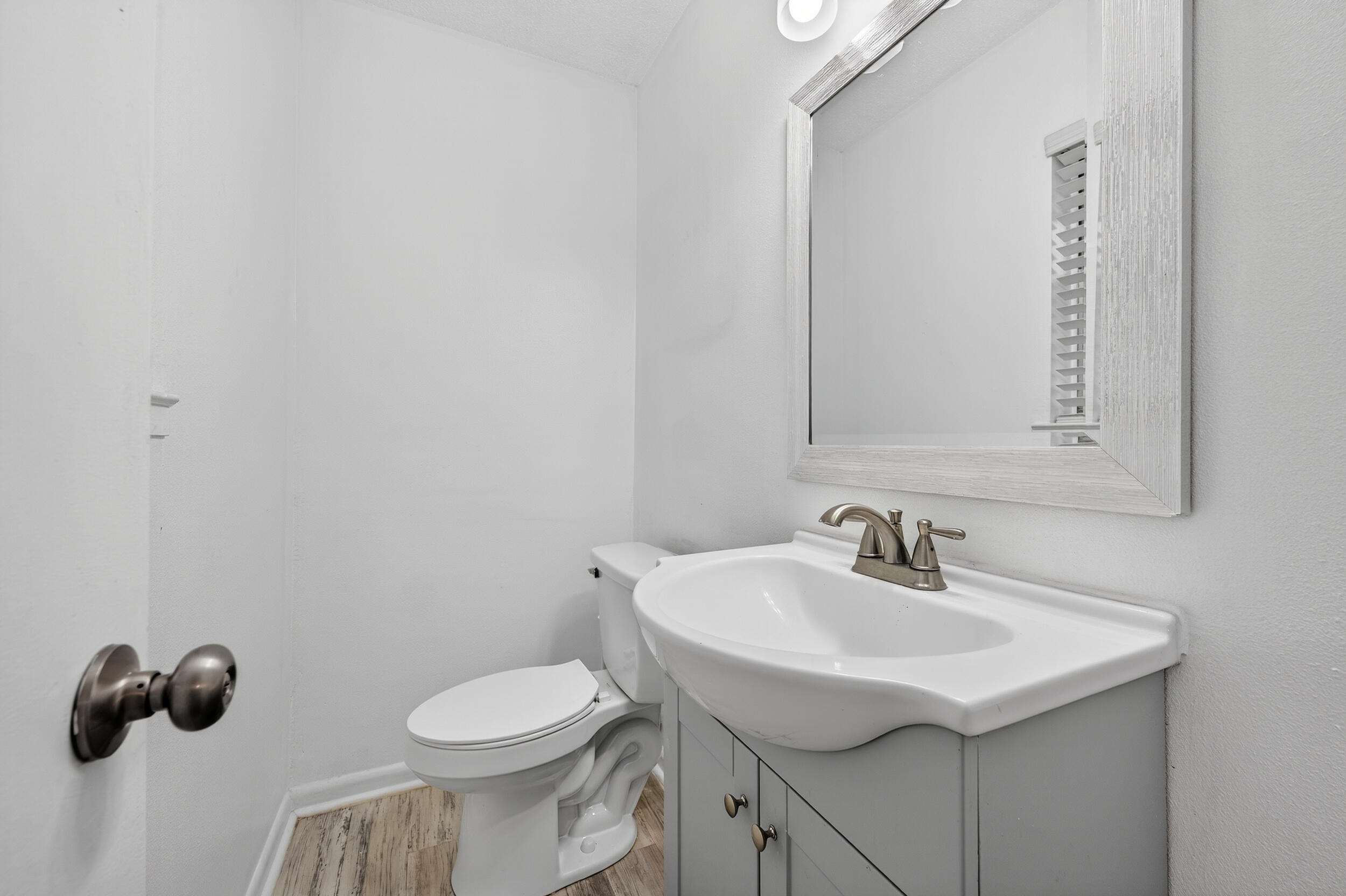 313 Brackin Street, Unit A Crestview, FL 32539 - Photo 19 of 28 a bathroom with a sink and a toilet