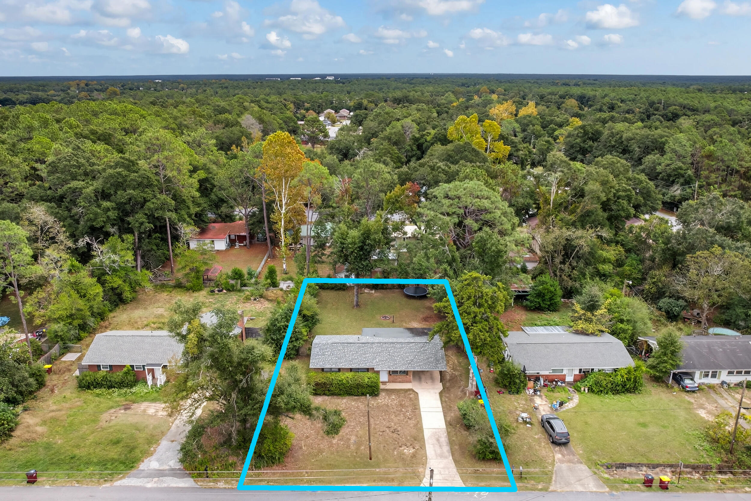 313 Brackin Street, Unit A Crestview, FL 32539 - Photo 23 of 28 an aerial view of residential houses with outdoor space
