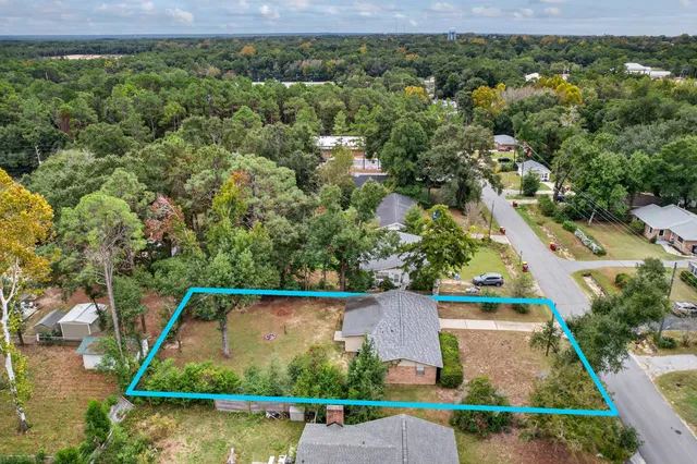an aerial view of house with swimming pool