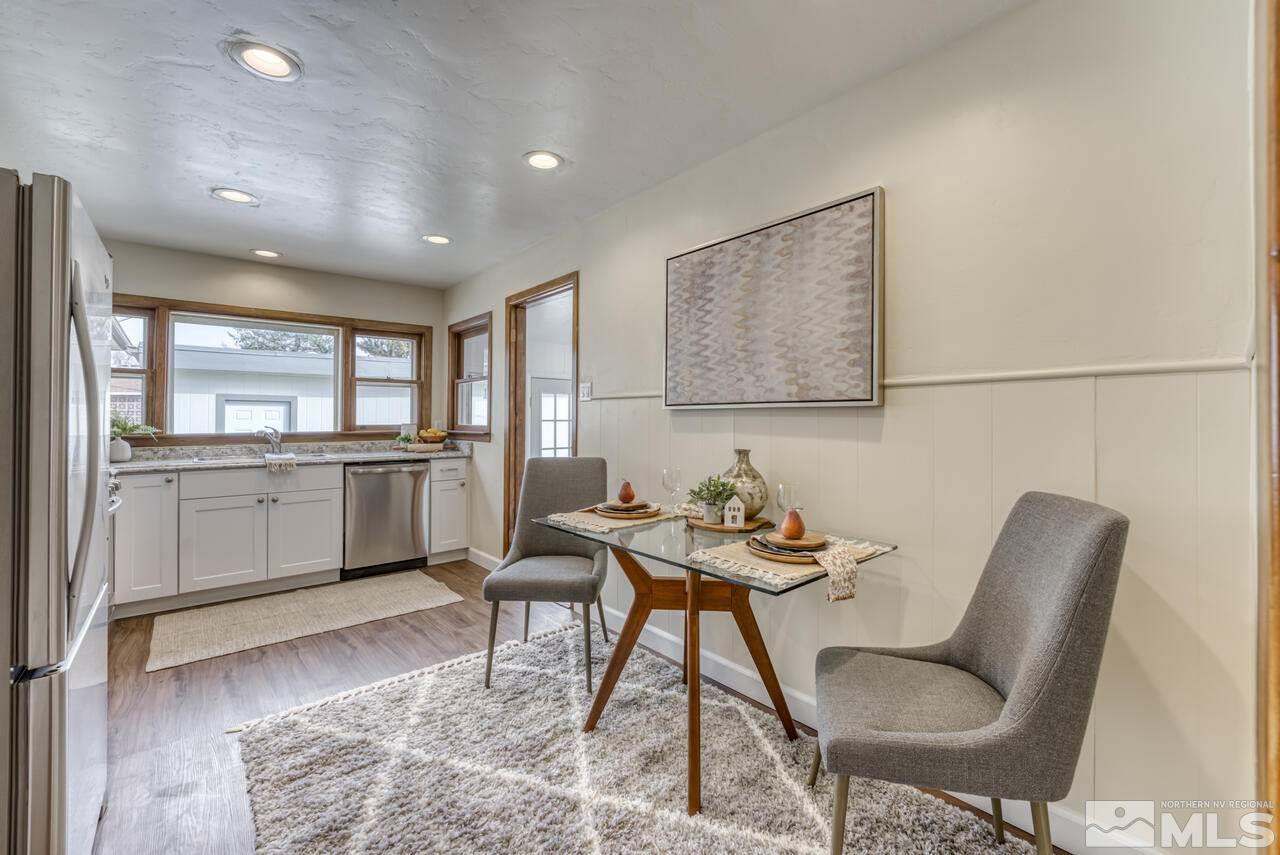 990 Yori Avenue Reno, NV 89502 - Photo 19 of 40 a view of a dining room with furniture and wooden floor