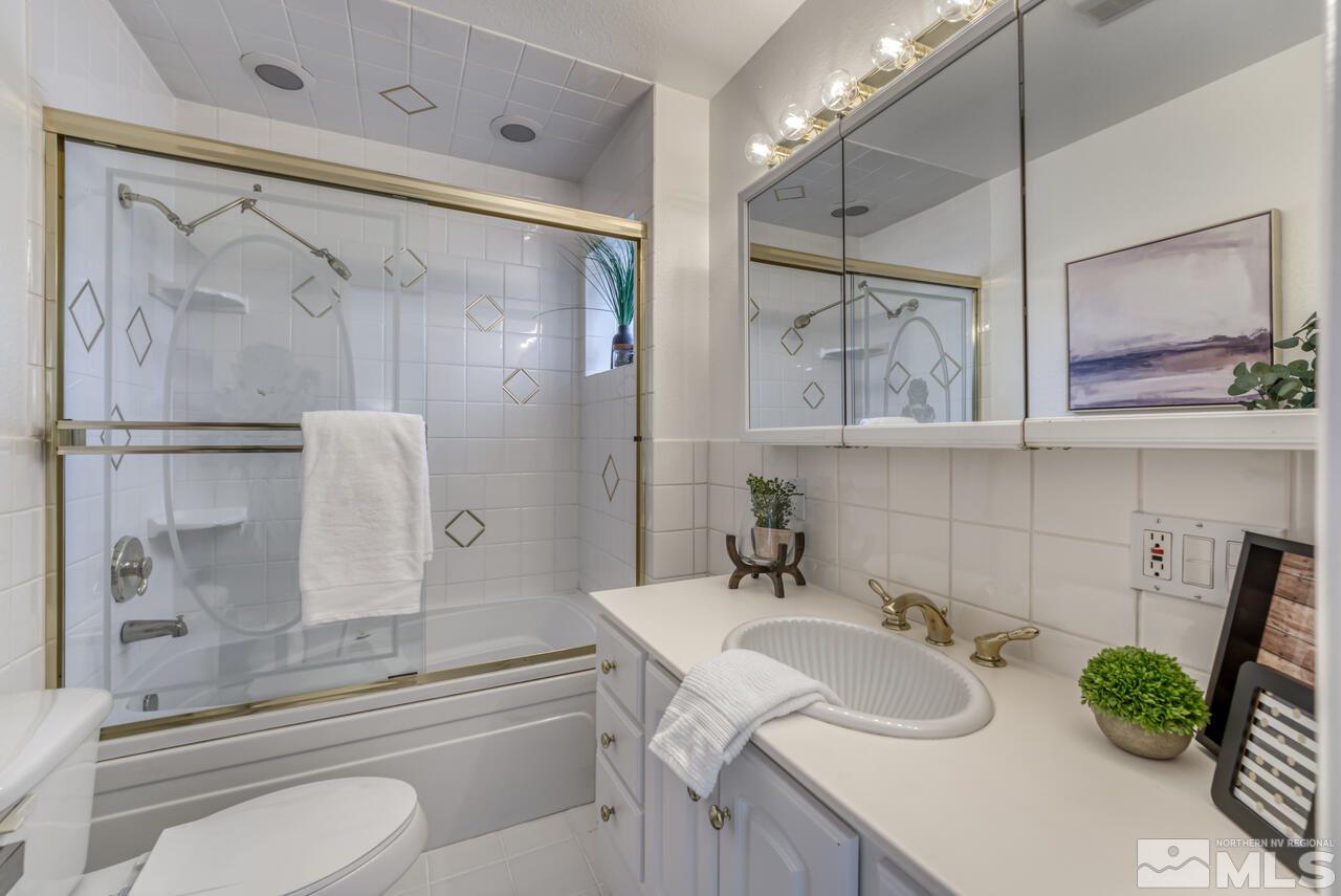 990 Yori Avenue Reno, NV 89502 - Photo 30 of 40 a bathroom with a sink toilet and shower