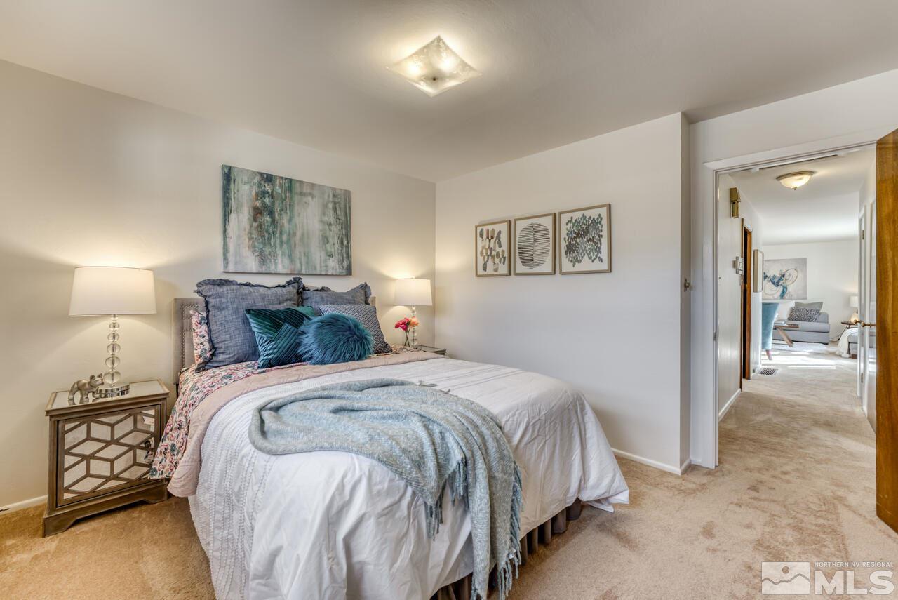 990 Yori Avenue Reno, NV 89502 - Photo 32 of 40 a bedroom with a bed and a mirror