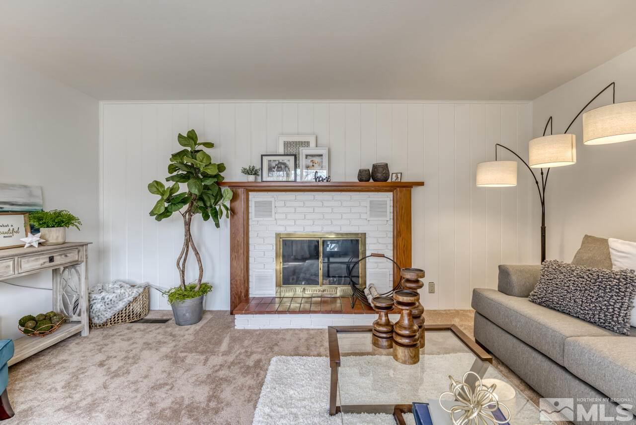 990 Yori Avenue Reno, NV 89502 - Photo 10 of 40 a living room with furniture and a fireplace