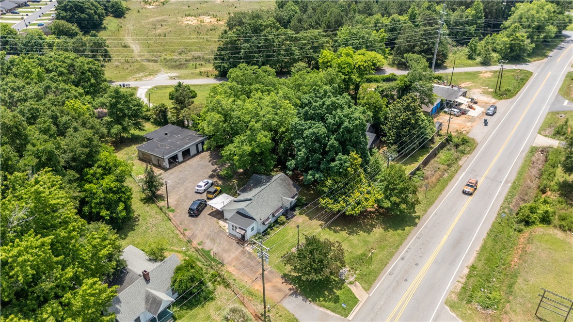 608 29 N Bypass Anderson, SC 29621 - Photo 19 of 20 An aerial perspective reveals a prime corner lot with a charming single-story residence and a detached garage/workshop building.