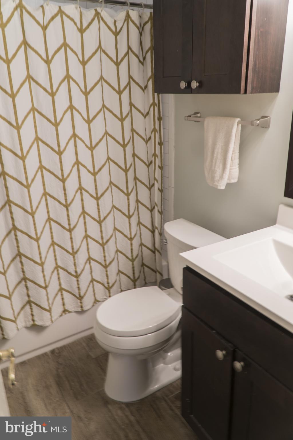 Updated Hall Bath with Tub Shower Subway Tile