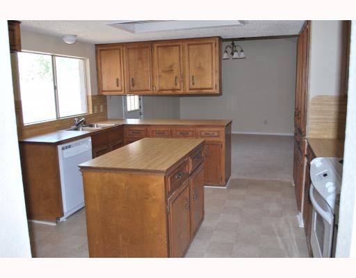 4106 Acushnet Drive Corpus Christi, TX 78413 - Photo 3 of 4 a kitchen with stainless steel appliances granite countertop a sink stove and microwave