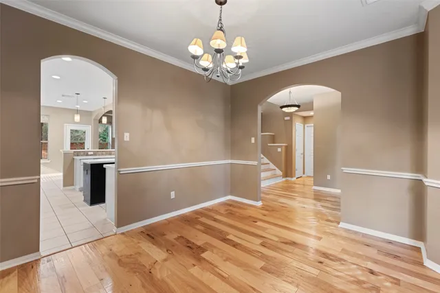 a kitchen with stainless steel appliances granite countertop a sink a stove and cabinets