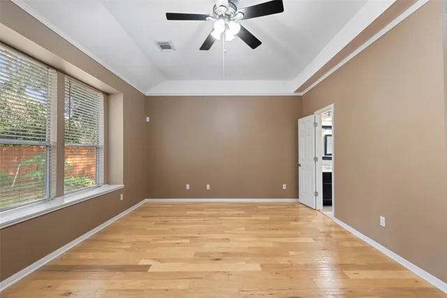 a spacious bathroom with a granite countertop sink a mirror and a bathtub