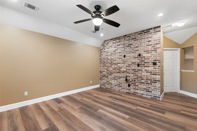 a view of room with window and ceiling fan