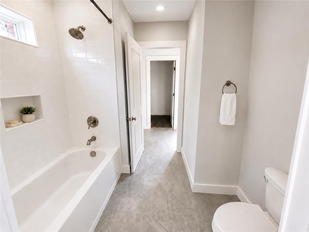 3104 Moyer Road Hellertown, PA 18055 - Photo 18 of 30 Clean lines and tiled finishes define this modern guest bathroom layout.