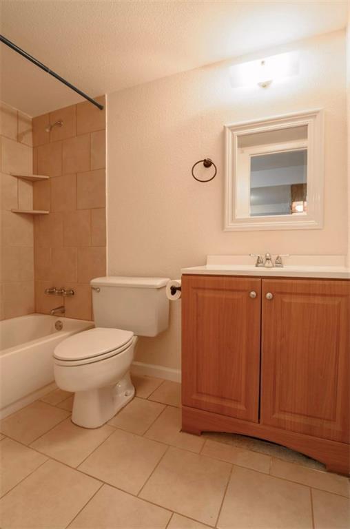 710 East Dean Keeton Street, Unit 207 Austin, TX 78705 - Photo 6 of 6 Functional full bathroom featuring practical tiled floors and a clean, accessible layout.