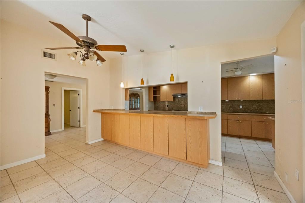 860 South Beneva Road Sarasota, FL 34232 - Photo 12 of 64 a view of a kitchen with a sink and dishwasher a refrigerator with white cabinets