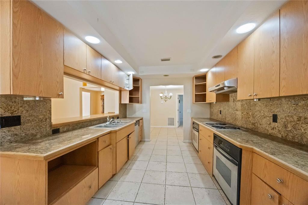 860 South Beneva Road Sarasota, FL 34232 - Photo 13 of 64 a kitchen with stainless steel appliances granite countertop a sink and a stove
