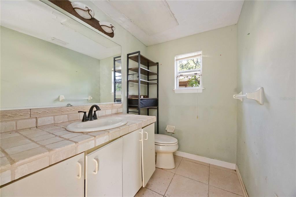 860 South Beneva Road Sarasota, FL 34232 - Photo 19 of 64 a bathroom with a sink a toilet and shower