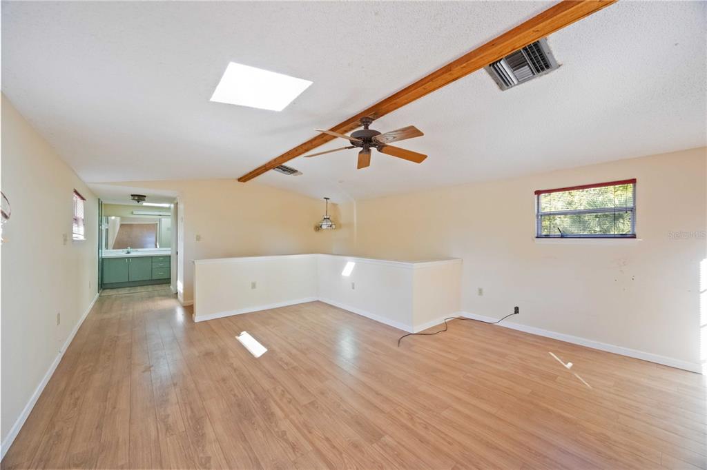 860 South Beneva Road Sarasota, FL 34232 - Photo 20 of 64 a view of an empty room with wooden floor and stairs