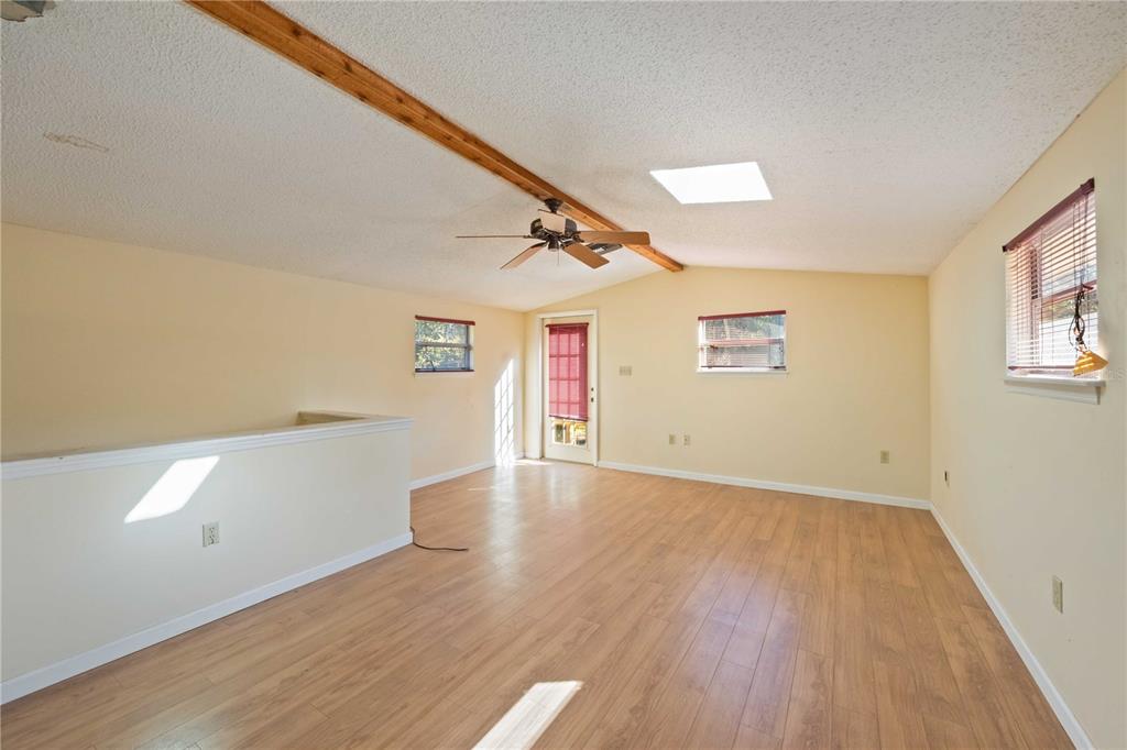 860 South Beneva Road Sarasota, FL 34232 - Photo 21 of 64 an empty room with wooden floor and windows
