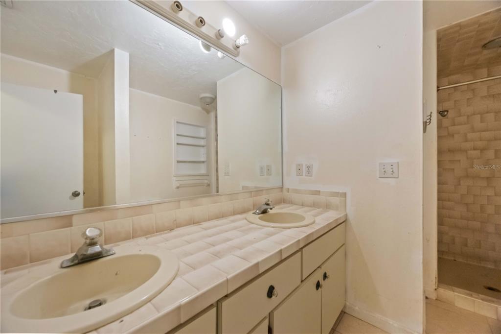 860 South Beneva Road Sarasota, FL 34232 - Photo 29 of 64 a bathroom with a sink double vanity and a mirror