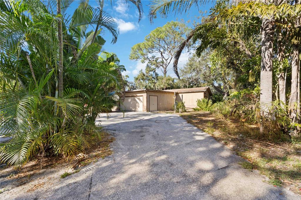 860 South Beneva Road Sarasota, FL 34232 - Photo 31 of 64 a view of a yard with plants and trees