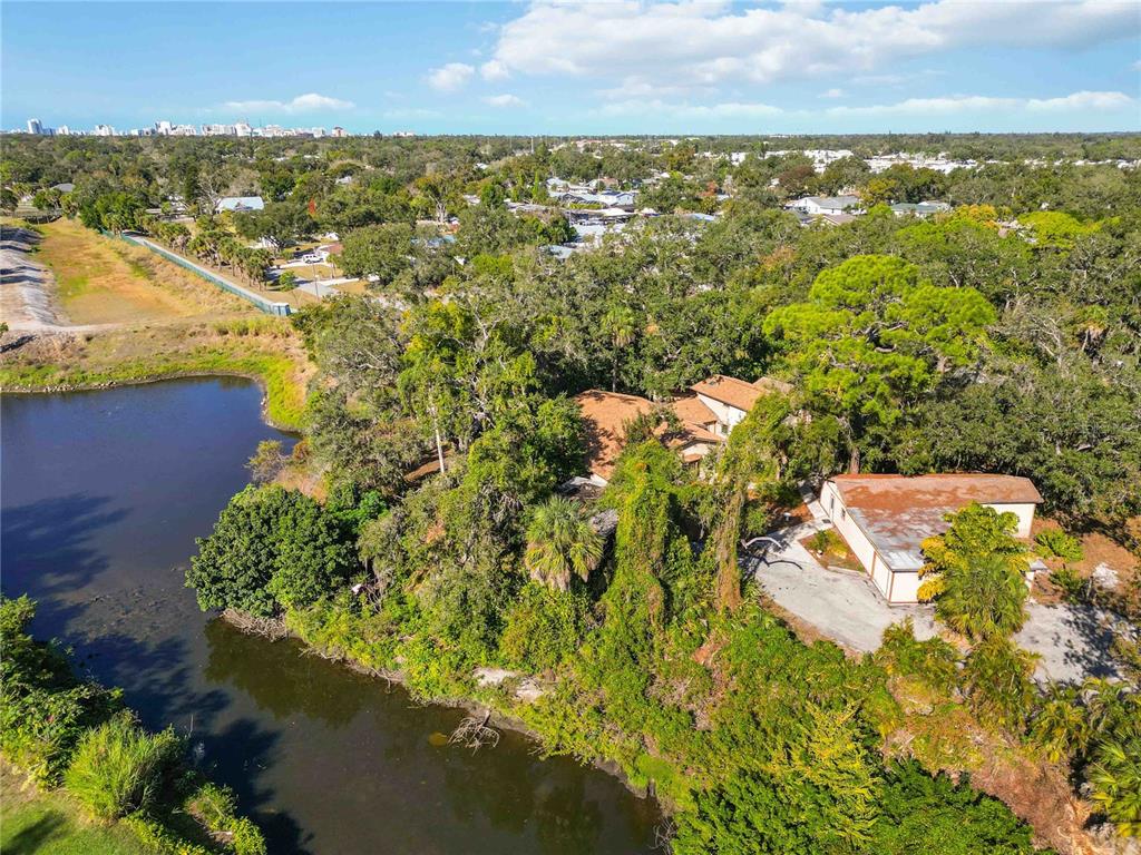 860 South Beneva Road Sarasota, FL 34232 - Photo 45 of 64 an aerial view of residential houses with outdoor space and trees