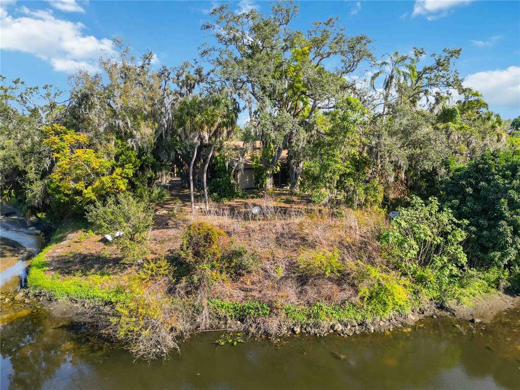 860 South Beneva Road Sarasota, FL 34232 - Photo 49 of 64 a view of swimming pool with lawn chairs and wooden fence