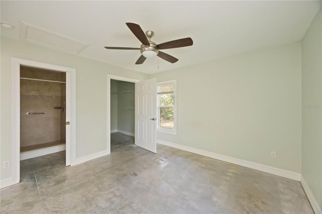 860 South Beneva Road Sarasota, FL 34232 - Photo 59 of 64 a view of a livingroom with a ceiling fan and wooden floor