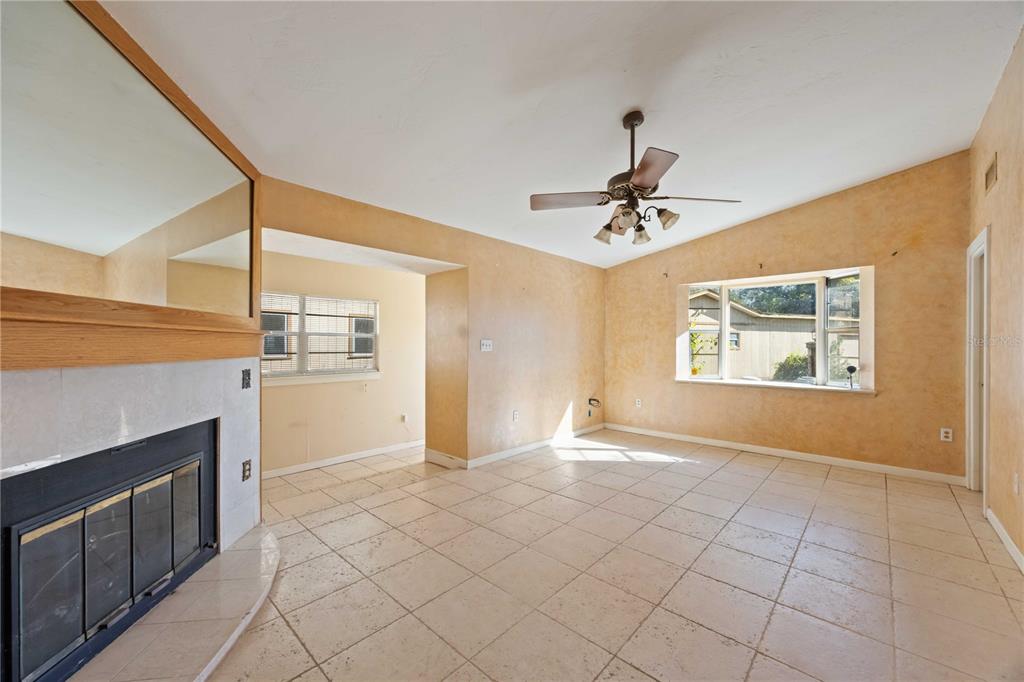 860 South Beneva Road Sarasota, FL 34232 - Photo 7 of 64 a view of an empty room with a ceiling fan and window