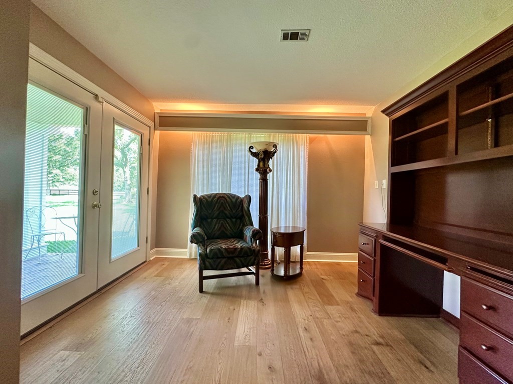 3405 Bethlehem Road Hudson, TX 75904 - Photo 11 of 41 a living room with furniture a flat screen tv and floor to ceiling window