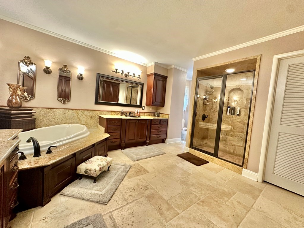 3405 Bethlehem Road Hudson, TX 75904 - Photo 13 of 41 a large bathroom with a tub sink and mirror