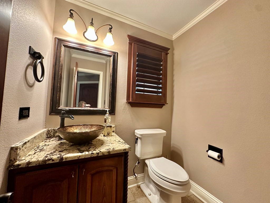 3405 Bethlehem Road Hudson, TX 75904 - Photo 19 of 41 a bathroom with a granite countertop toilet sink and mirror