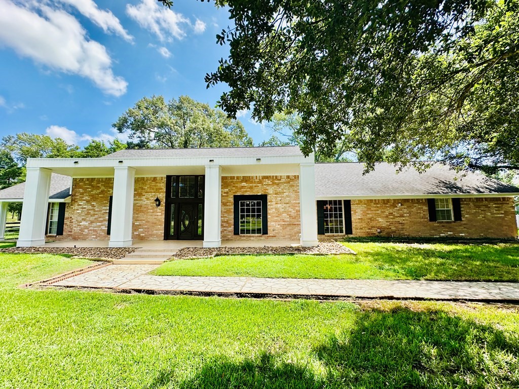 3405 Bethlehem Road Hudson, TX 75904 - Photo 3 of 41 a front view of a house with a garden and yard