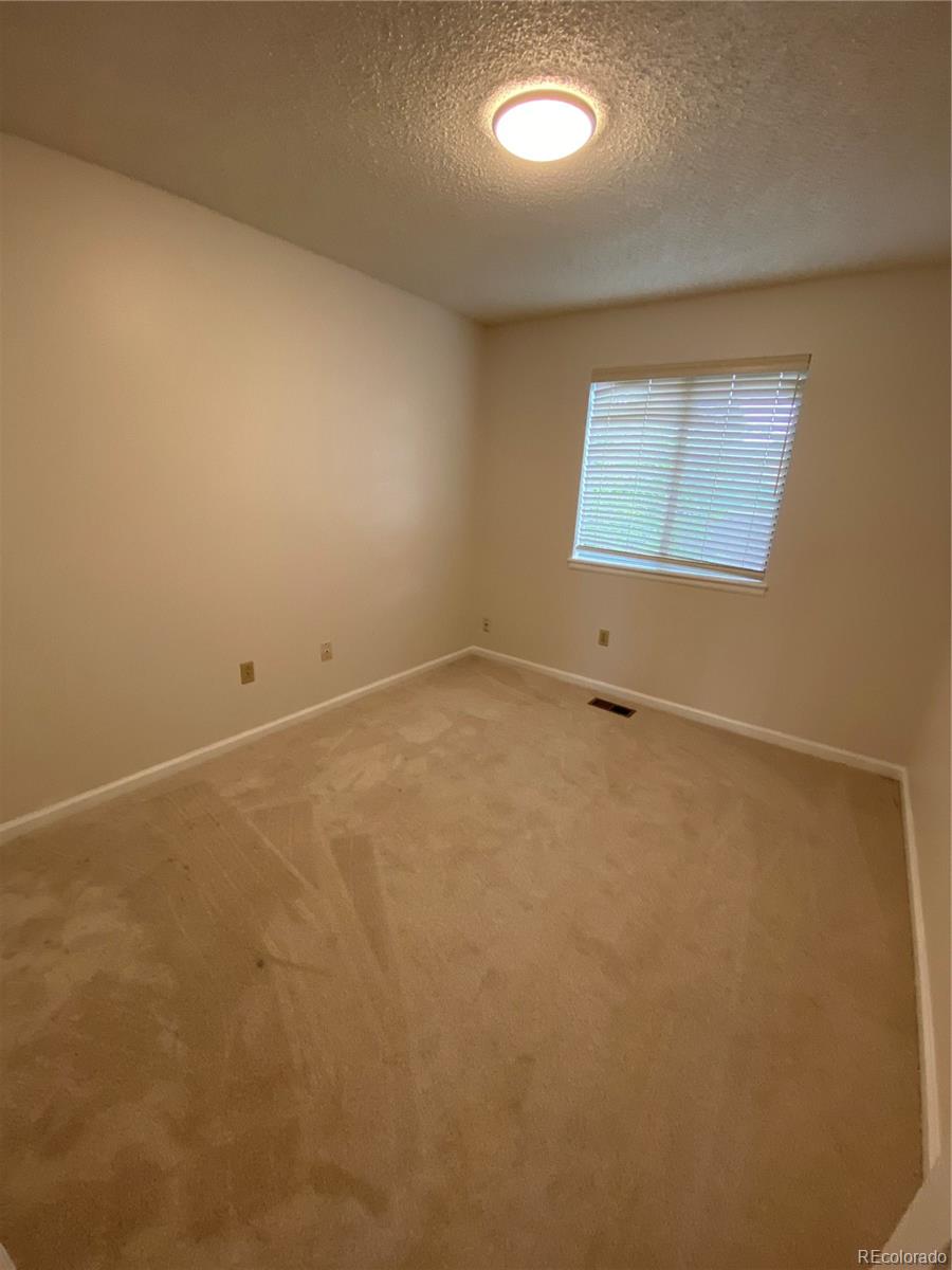 874 Homestead Drive Highlands Ranch, CO 80126 - Photo 13 of 13 an empty room with a window