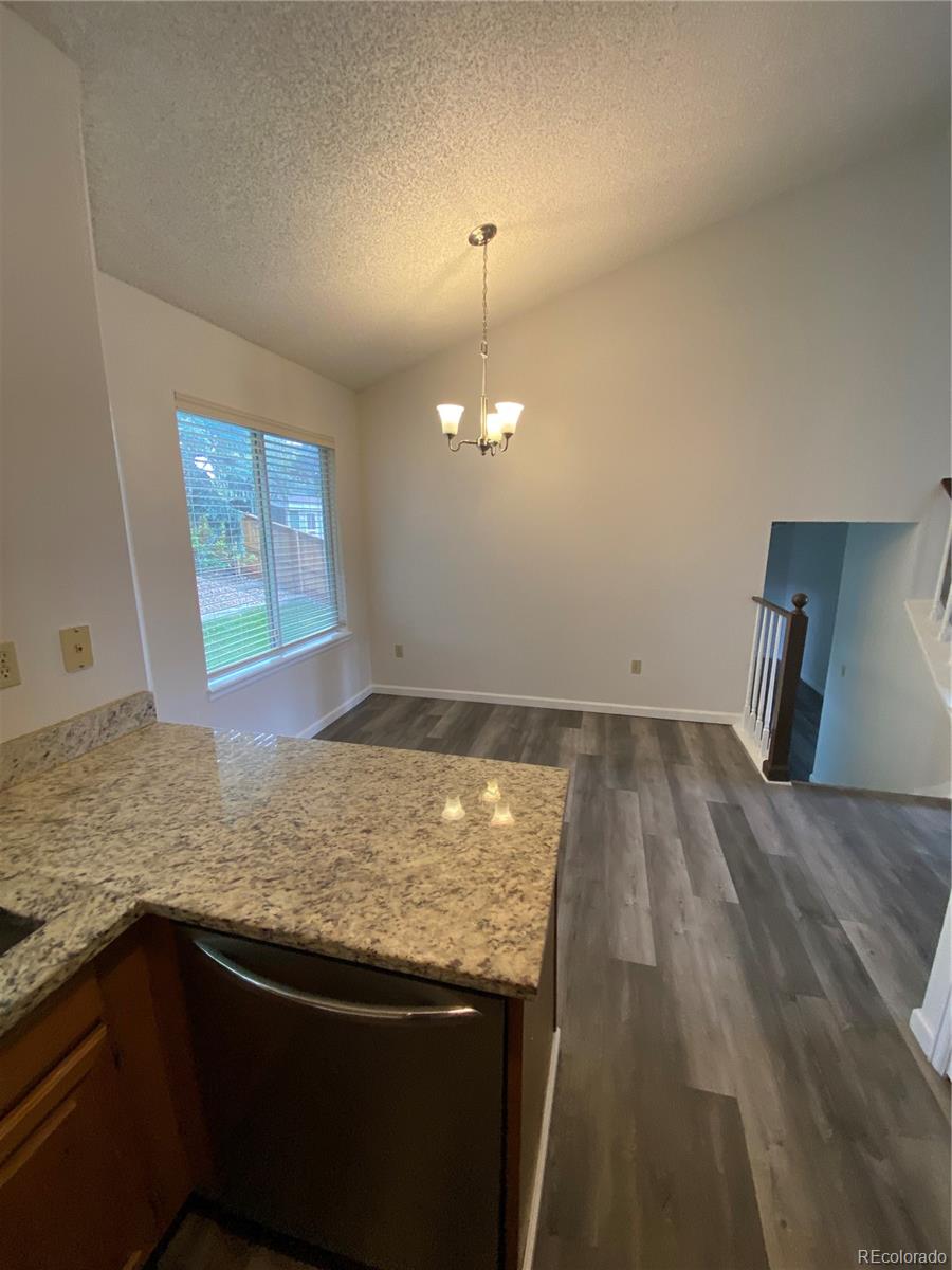874 Homestead Drive Highlands Ranch, CO 80126 - Photo 4 of 13 a view of a kitchen and a sink