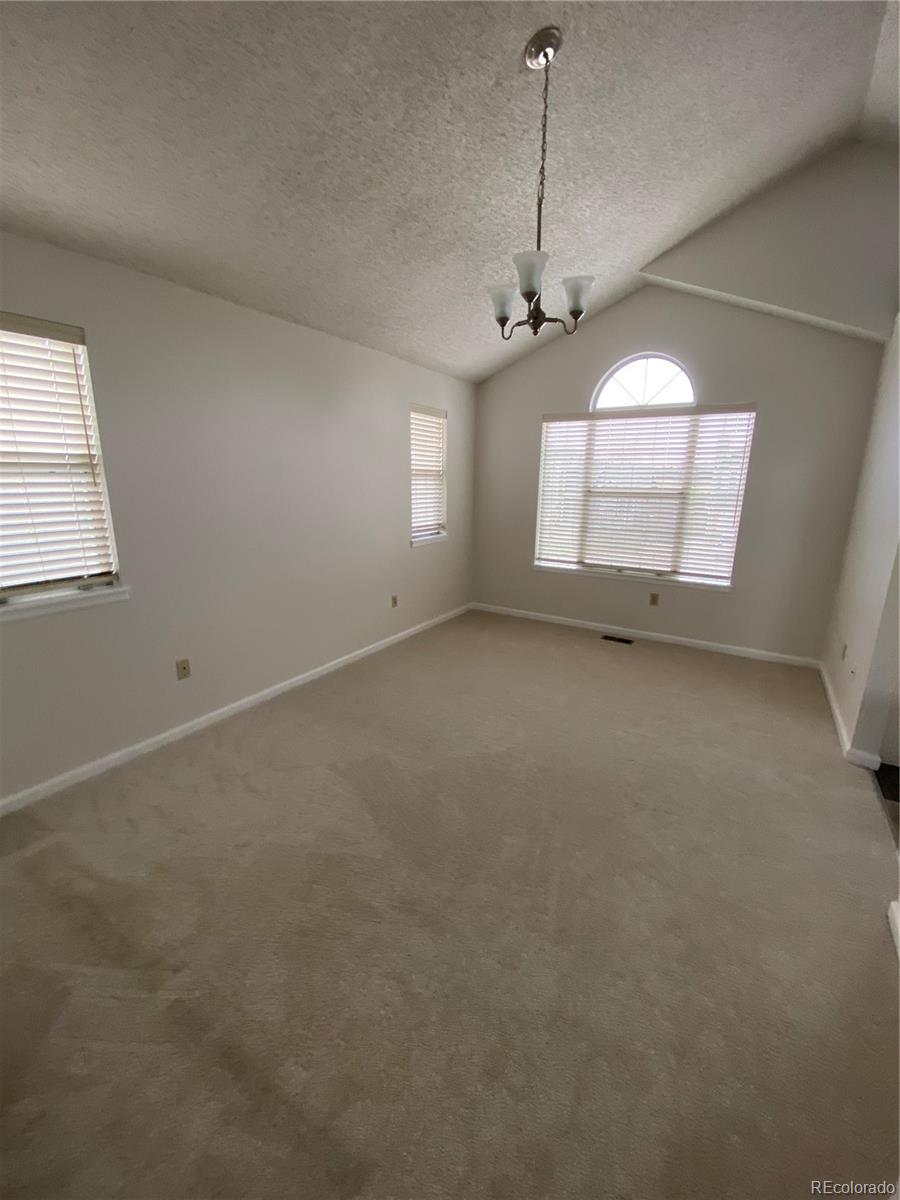 874 Homestead Drive Highlands Ranch, CO 80126 - Photo 9 of 13 an empty room with a window and a ceiling fan